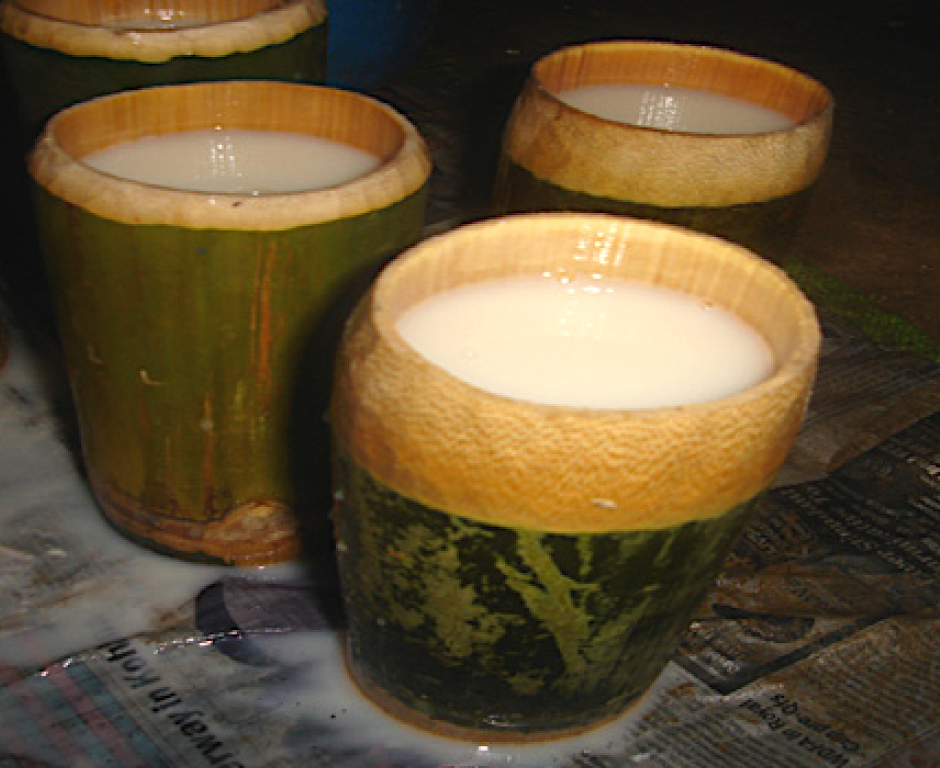 Aos people from Nagaland., N-E India. Zutho beer served in bamboo cups