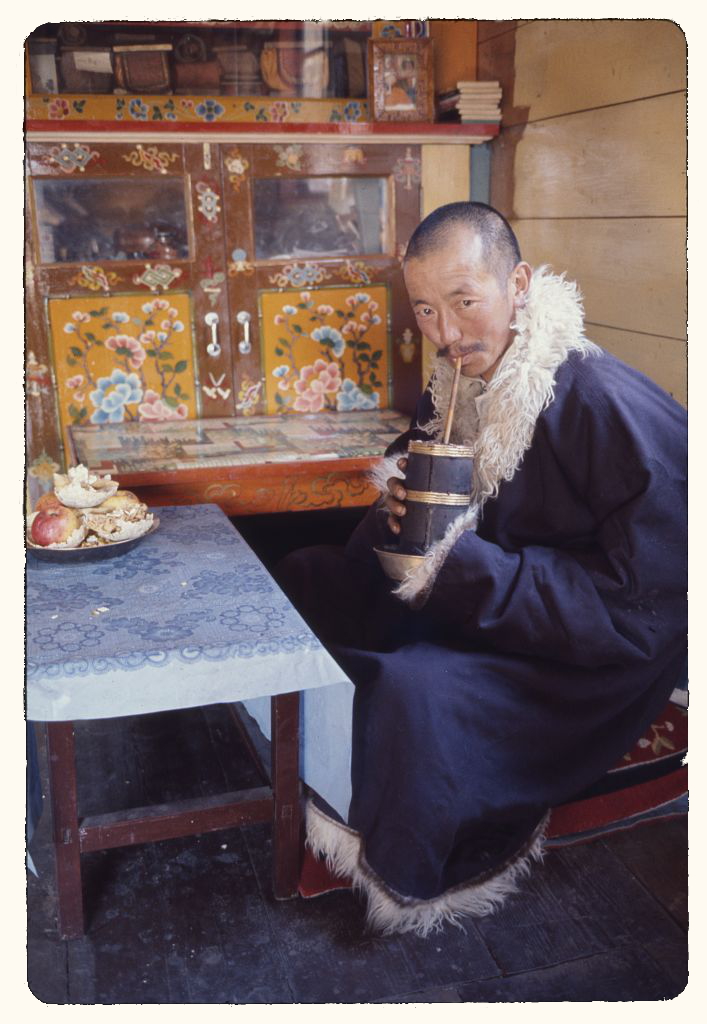 Rinchen Namgyal Lachungpa drinking millet beer Lachung, Sikkim 1965